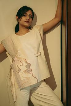 Metamorphosis Unisex Bib Three via Lafaani
