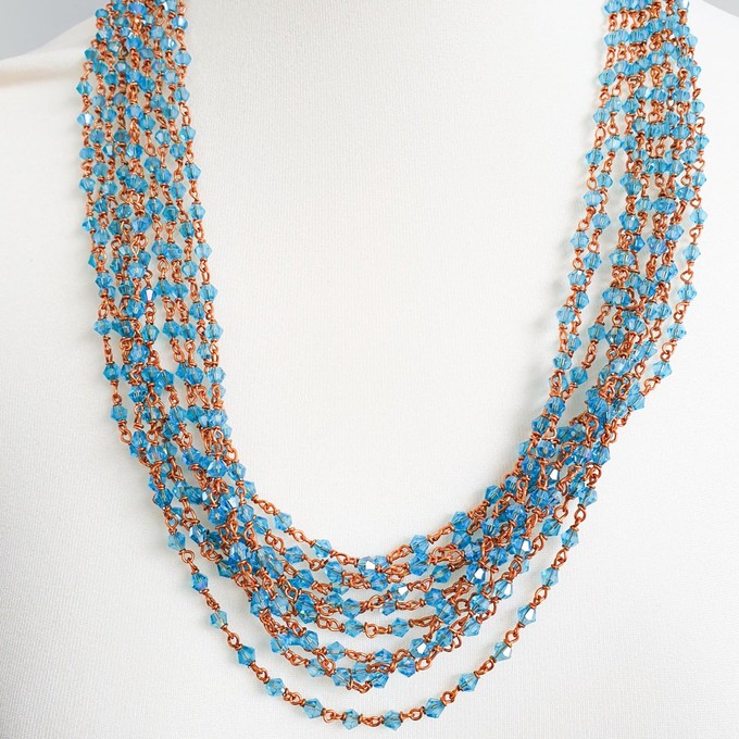 Handmade glass beaded necklace with copper wire, light blue beads from Shakti.ism